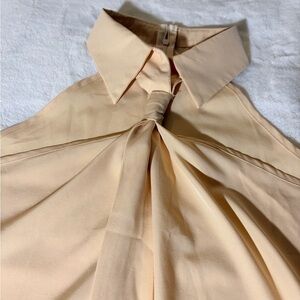 Beige Sleeveless Blouse with Knot Detail